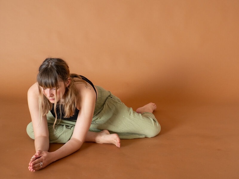 Leyla in restorative yoga pose